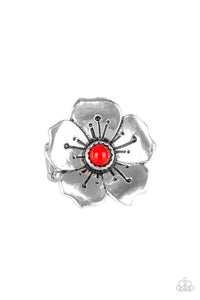 A bright red bead is pressed into the center of a blooming silver flower radiating with antiqued details for a whimsical look. Features a stretchy band for a flexible fit.  Sold as one individual ring.