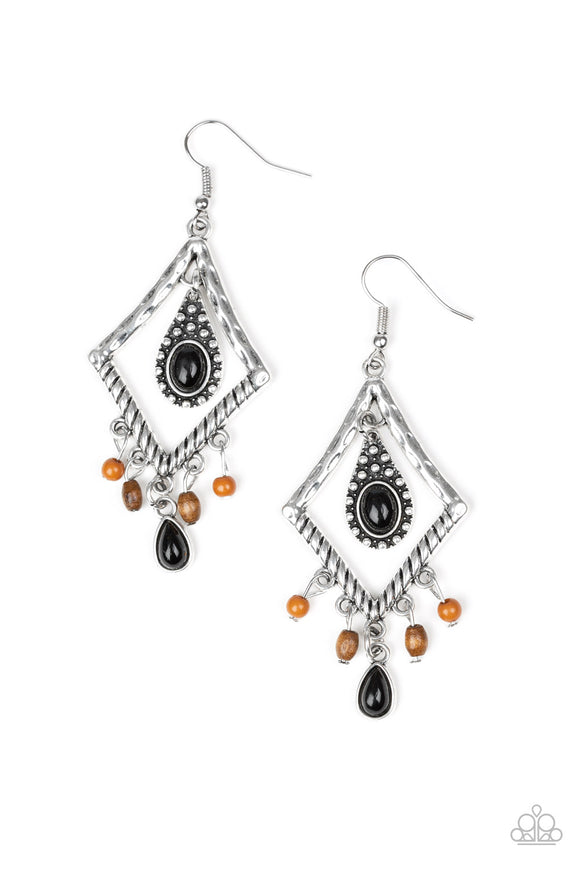 Featuring a shiny black bead, a studded silver teardrop swings from the top of a kite-shaped silver frame. Dainty brown beads and wooden accents swing from the bottom of a hammered frame, creating a seasonal fringe. Earring attaches to a standard fishhook fitting.  Sold as one pair of earrings.