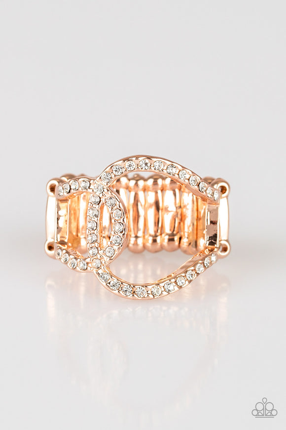 Encrusted in glassy white rhinestones, two rose gold links join into an asymmetrical band across the finger for a refined look. Features a stretchy band for a flexible fit.  Sold as one individual ring.