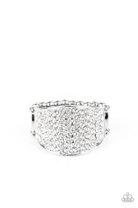 Countless white rhinestones are encrusted along a thick silver band for a spellbinding look. Features a stretchy band for a flexible fit.  Sold as one individual ring.