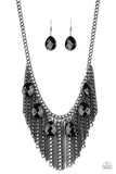 Infused with a row of faceted black teardrops, mismatched strands of gunmetal chains stream from the bottom of a glistening gunmetal chain, creating a statement-making fringe below the collar. Features an adjustable clasp closure.  Sold as one individual necklace. Includes one pair of matching earrings.