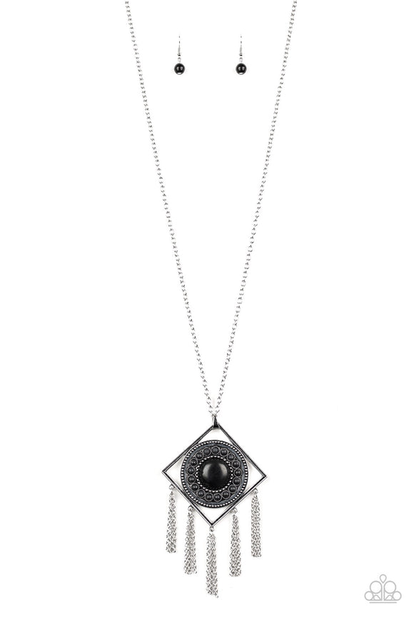 Radiating with studded details and earthy black stones, a round frame is nestled inside of an airy silver square for a tribal inspired look. Attached to a lengthened silver chain, the colorful stone pendant gives way to rows of silver chain fringe for a statement-making finish. Features an adjustable clasp closure.  Sold as one individual necklace. Includes one pair of matching earrings.