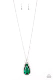 A dramatically oversized green gem and edgy silver frame swing from a glassy white rhinestone fitting at the bottom of a lengthened silver chain for a glamorous look. Features an adjustable clasp closure.  Sold as one individual necklace. Includes one pair of matching earrings.