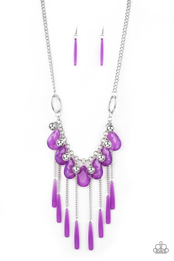Shiny silver beads and faceted purple teardrops drip from the bottom of a shimmery silver chain below the collar. Flared purple beading swings from the bottoms of free-falling silver chains, creating a vivacious fringe
