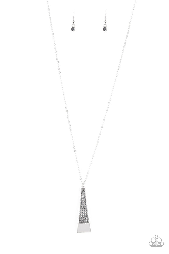 Encrusted in glittery hematite rhinestones, a triangular-shaped pendulum swings from the bottom of a lengthened silver chain for an edgy look. Features an adjustable clasp closure.