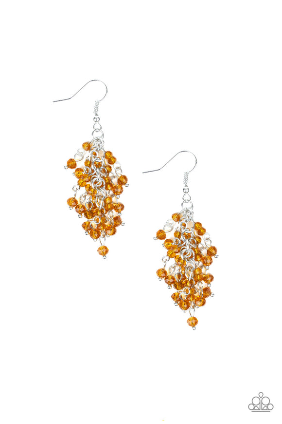 Twinkling brown crystal-like beads are threaded along dainty silver rods, creating a sparkling fringe. Earring attaches to a standard fishhook fitting.  Sold as one pair of earrings.