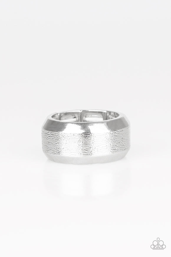 The center of a beveled silver band has been delicately hammered in shimmery detail for a metro inspired look. Features a stretchy band for a flexible fit.  Sold as one individual ring.