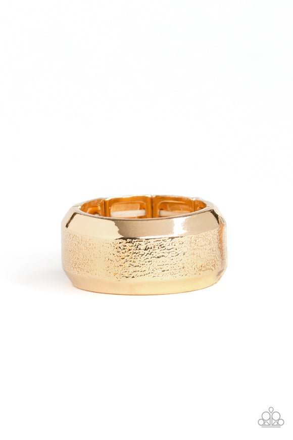 The center of a beveled gold band has been delicately hammered in shimmery detail for a metro inspired look. Features a stretchy band for a flexible fit.  Sold as one individual ring.