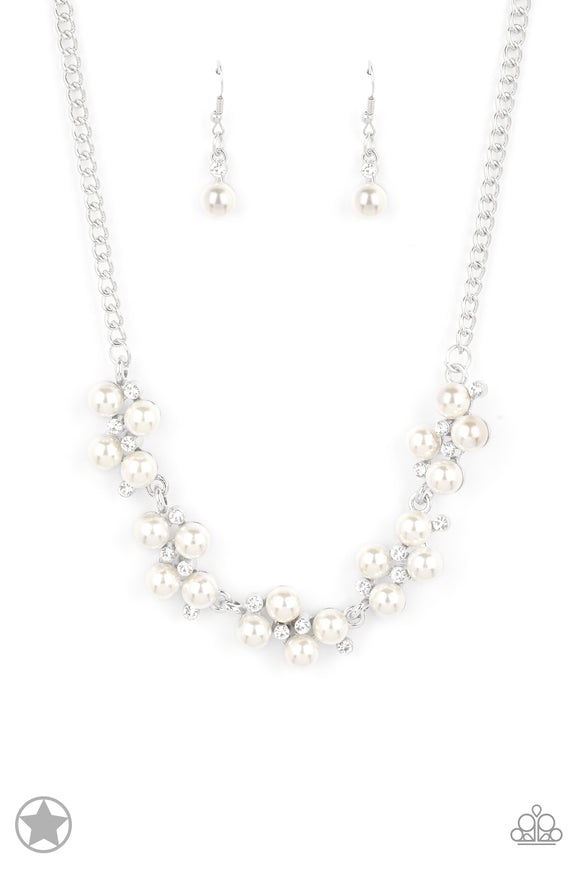Dainty clusters of shimmery white pearls are dusted with sparkling rhinestones, creating a romantic, timeless design. Features an adjustable clasp closure.  Sold as one individual necklace. Includes one pair of matching earrings.