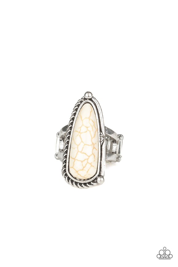 Chiseled into an oblong teardrop shape, a refreshing white stone is pressed into an asymmetrically patterned silver frame for an artisan inspired look. Features a stretchy band for a flexible fit.  Sold as one individual ring.