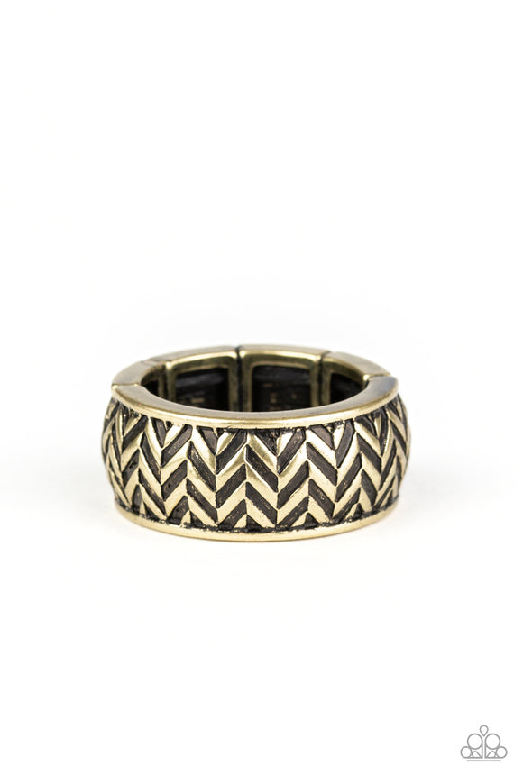 Brushed in an antiqued finish, stacked rows of chevron-like patterns are etched and embossed across a thick brass band for a tactile look. Features a stretchy band for a flexible fit.  Sold as one individual ring.