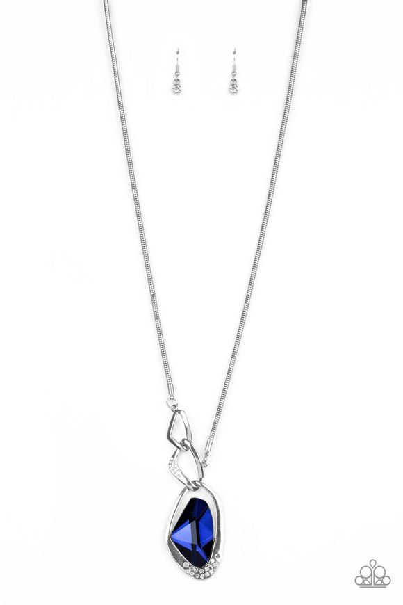 A faceted blue gem is nestled inside of a shimmery silver frame encrusted in dainty white rhinestones. The glittery pendant asymmetrically links with abstract silver frames at the bottom of a lengthened silver rounded snake chain for a modern look. Features an adjustable clasp closure.  Sold as one individual necklace. Includes one pair of matching earrings.