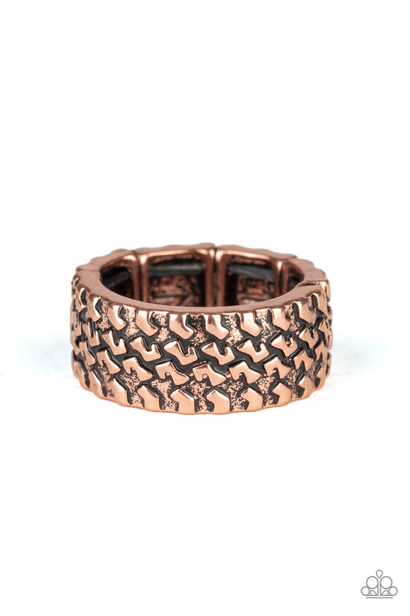 Embossed in a tactile tread-like pattern, a glistening copper band curls around the finger for an edgy look. Features a stretchy band for a flexible fit.  Sold as one individual ring.