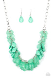 A minty green collection of polished and crystal-like teardrop beads cluster along the bottom of a shimmery silver chain, creating a flirtatious fringe below the collar. Features an adjustable clasp closure.  Sold as one individual necklace. Includes one pair of matching earrings.