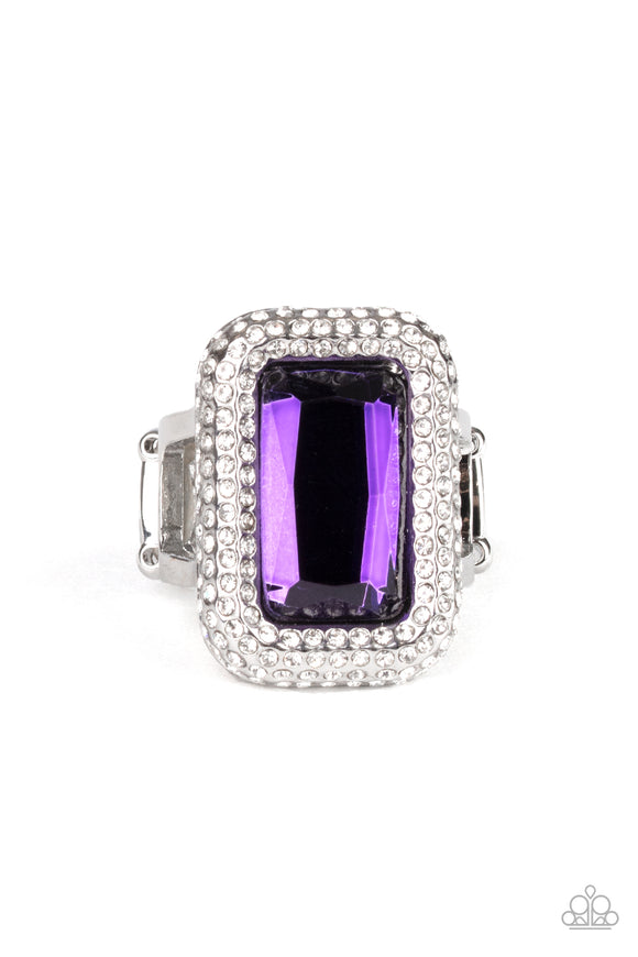 Featuring a regal emerald style cut, a dramatically oversized purple rhinestone is nestled inside a silver frame encrusted in row after row of glassy white rhinestones for a blinding look. Features a stretchy band for a flexible fit.  Sold as one individual ring.