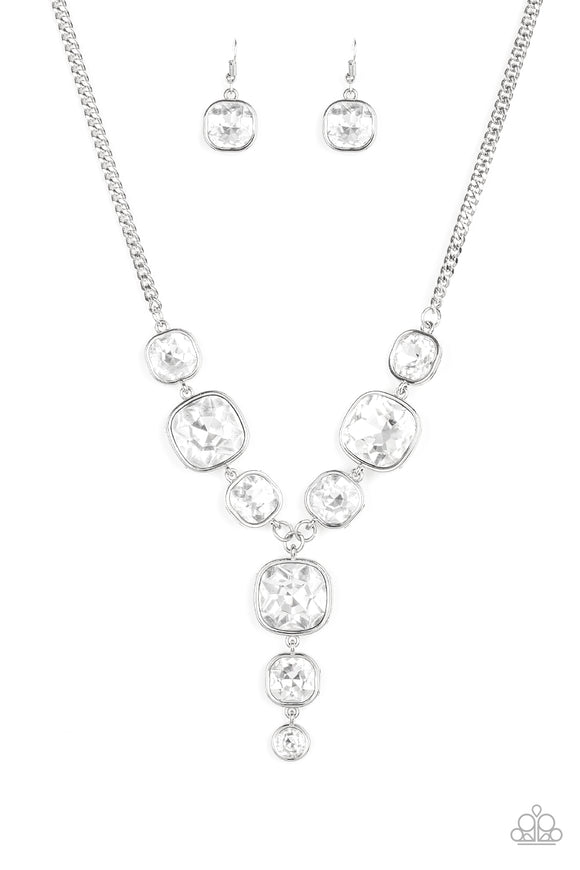 Featuring sleek silver frames, a dramatic collection of white gems cascade from the bottom thick silver chain. Additional gems trickle from the center, creating a glamorous extended pendant below the collar. Features an adjustable clasp closure.  Sold as one individual necklace. Includes one pair of matching earrings.