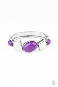 Vivacious purple oval beads and antiqued silver square frames are pressed into the textured front of a cuff-like bangle, creating a colorful pop of color around the wrist. Features a hinged closure.  Sold as one individual bracelet.