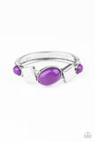 Vivacious purple oval beads and antiqued silver square frames are pressed into the textured front of a cuff-like bangle, creating a colorful pop of color around the wrist. Features a hinged closure.  Sold as one individual bracelet.