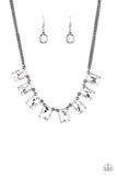 Encased in sleek gunmetal fittings, a regal chain of oversized white emerald style gems link below the collar for a timeless finish. Features an adjustable clasp closure.  Sold as one individual necklace. Includes one pair of matching earrings.