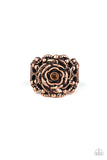 Infused with a studded filigree backdrop, antiqued copper petals fan out from a dainty topaz rhinestone, creating a regal rose atop the finger. Features a stretchy band for a flexible fit.  Sold as one individual ring.