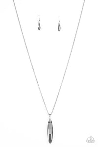 Featuring a metallic back, a smoky faceted gem swings from the bottom of a lengthened silver popcorn chain for an edgy look. Features an adjustable clasp closure.  Sold as one individual necklace. Includes one pair of matching earrings.