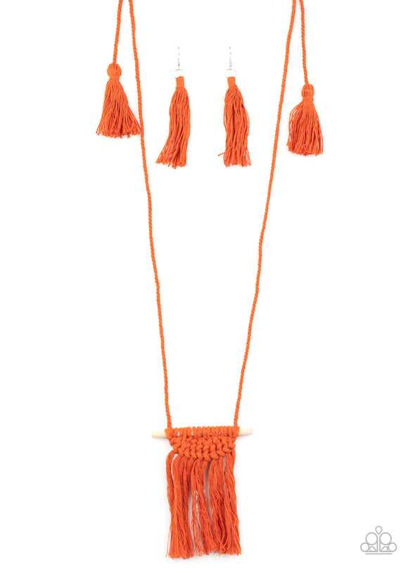 Orange cording delicately wraps around a dainty wooden dowel, knotting into a tasseled macrame centerpiece at the bottom of a dramatically lengthened display. Features an adjustable sliding knot closure.  Sold as one individual necklace. Includes one pair of matching earrings.