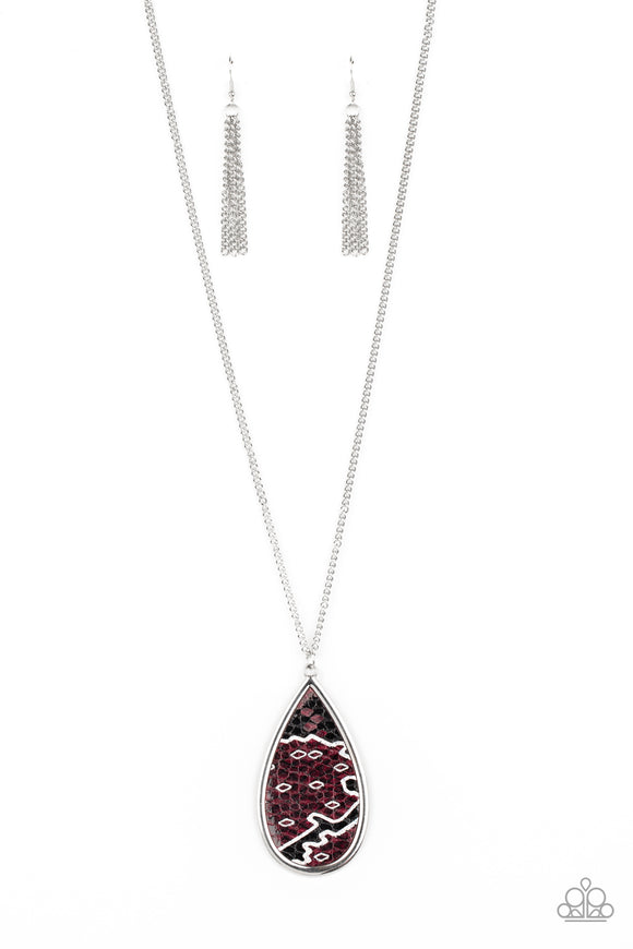 Featuring a metallic scale print, a piece of purple leather embellishes the center of an oversized silver teardrop at the bottom of a lengthened silver chain for a wild look. Features an adjustable clasp closure.  Sold as one individual necklace. Includes one pair of matching earrings.