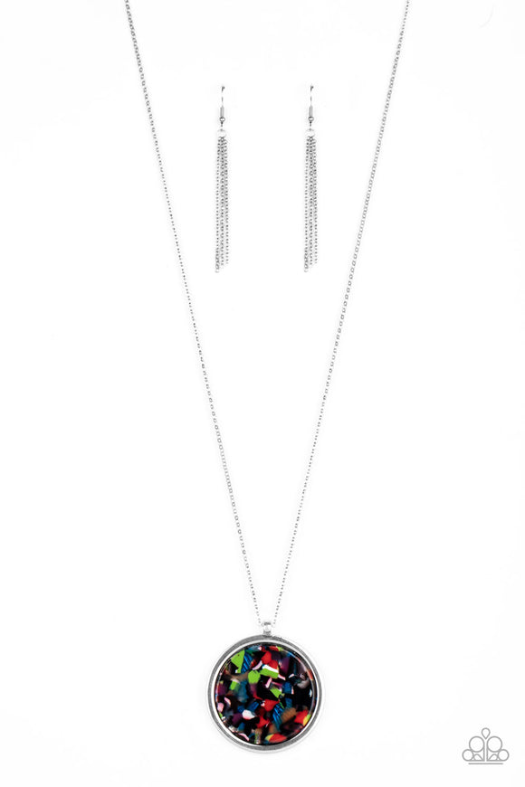 Featuring a multicolored tortoise shell pattern, a flat acrylic circle is pressed into a sleek silver ring, creating a colorfully retro pendant at the bottom of a lengthened silver chain. Features an adjustable clasp closure.  Sold as one individual necklace. Includes one pair of matching earrings.