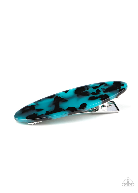 Featuring a blue and black tortoise shell finish, an oval acrylic frame pulls back the hair for a retro look. Features a standard hair clip on the back.  Sold as one individual hair clip.