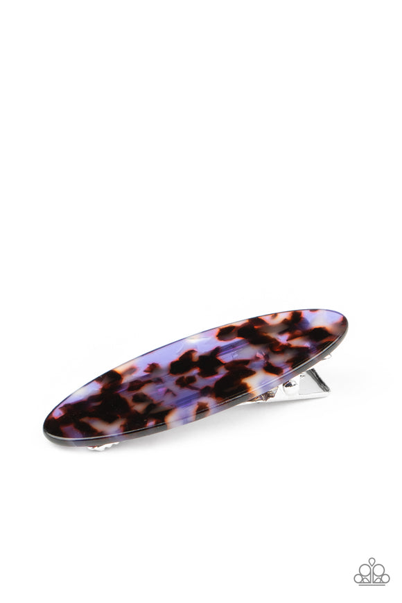 Featuring a purple and brown tortoise shell finish, an oval acrylic frame pulls back the hair for a retro look. Features a standard hair clip on the back.  Sold as one individual hair clip.