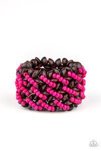 A collection of dainty pink wooden beads and brown wooden discs are threaded along knotted stretchy bands, creating a tropical floral pattern around the wrist.  Sold as one individual bracelet.