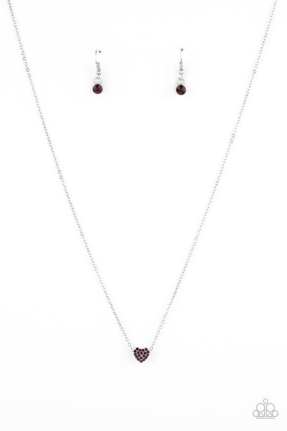 The front of a dainty silver frame is encrusted in glassy purple rhinestones, creating a charmingly colorful pendant below the collar. Features an adjustable clasp closure.  Sold as one individual necklace. Includes one pair of matching earrings.