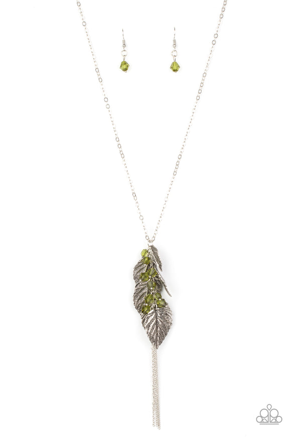 A whimsical tassel of silver leaf frames, Military Olive crystal-like beads, and shimmery silver chains cluster at the bottom of a lengthened silver chain for a colorfully seasonal look. Features an adjustable clasp closure.