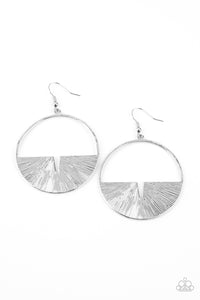 Embossed in radiant linear textures, a crescent silver frame is nestled along the bottom of a textured silver hoop for an edgy look. Earring attaches to a standard fishhook fitting.  Sold as one pair of earrings.