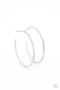 Featuring flattened sections, a textured silver hoop boldly curls around the ear for an edgy flair. Earring attaches to a standard post fitting. Hoop measures approximately 1 3/4" in diameter.  Sold as one pair of hoop earrings.