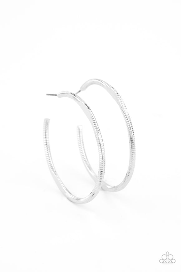 Featuring flattened sections, a textured silver hoop boldly curls around the ear for an edgy flair. Earring attaches to a standard post fitting. Hoop measures approximately 1 3/4