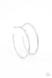 Featuring flattened sections, a textured silver hoop boldly curls around the ear for an edgy flair. Earring attaches to a standard post fitting. Hoop measures approximately 1 3/4" in diameter.  Sold as one pair of hoop earrings.