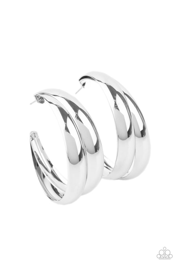 Two thick silver bars delicately overlap into a boldly oversized hoop. Earring attaches to a standard post fitting. Hoop measures approximately 2