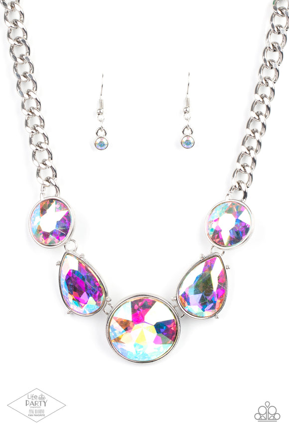 Infused with heavy silver chain, an exaggerated display of round and teardrop-shaped iridescent rhinestones connects below the collar for a blinding look. Features an adjustable clasp closure.  Sold as one individual necklace. Includes one pair of matching earrings.