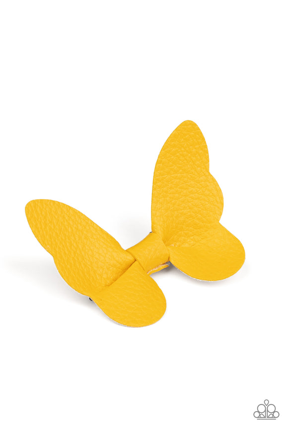 Featuring scalloped edges, a piece of yellow leather delicately knots into a beautiful butterfly. Features a standard hair clip on the back.  Sold as one individual hair clip.