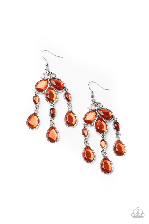 Featuring smooth and faceted surfaces, a glassy collection of orange teardrop crystals delicately coalesce into a whimsical chandelier. A dainty white rhinestone crowns the top of the regal display for a sparkly finish. Earring attaches to standard fishhook fitting.  Sold as one pair of earrings.