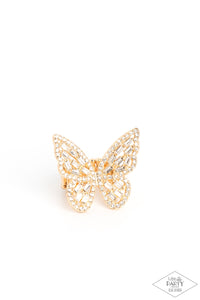 Dainty white emerald cut rhinestones are sprinkled across the golden wings of a butterfly that is encrusted in glassy white rhinestones for a dramatically dazzling finish. Features a stretchy band for a flexible fit.  Sold as one individual ring.