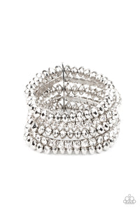 Held together with a sleek silver fitting, edgy rows of faceted silver beads and glittery white rhinestones are threaded along stretchy bands around the wrist, creating glamorous layers.  Sold as one individual bracelet.