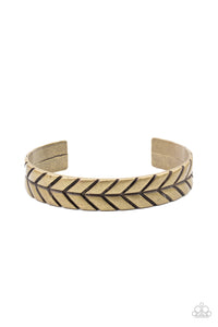 Stamped in an arrow pattern, an antiqued brass cuff curls around the wrist for a textured finish.  Sold as one individual bracelet.