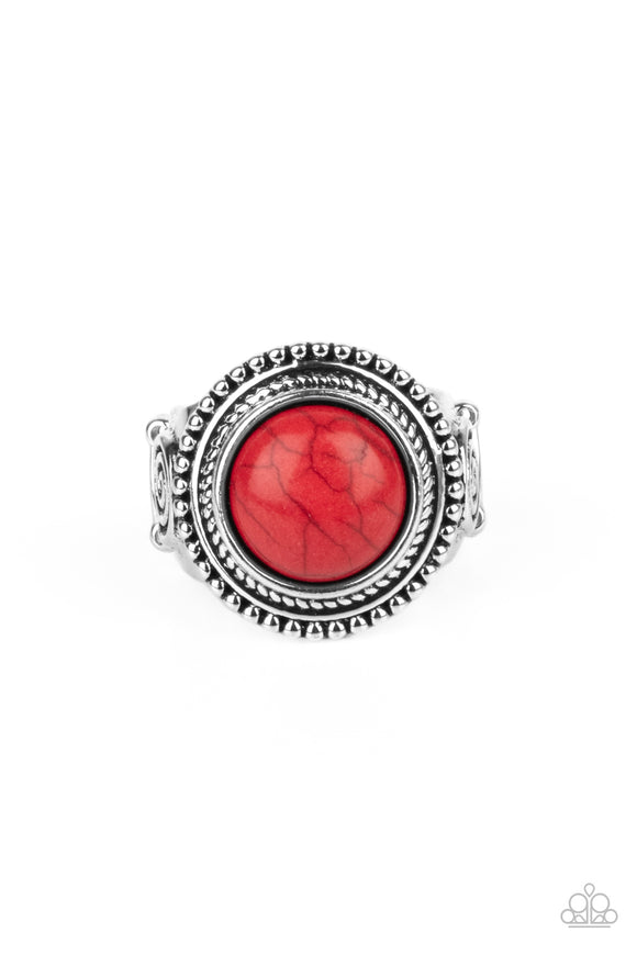 A round red stone is pressed into the center of a studded silver frame embossed with rustic swirls, creating a trendy tribal inspired centerpiece atop the finger. Features a stretchy band for a flexible fit.  Sold as one individual ring.