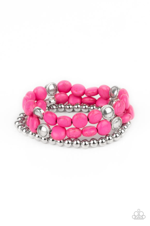 A vivacious collection of pink stone beads, ornate silver accents, and classic silver beads are threaded along stretchy bands around the wrist for a seasonally layered look.  Sold as one set of three bracelets.