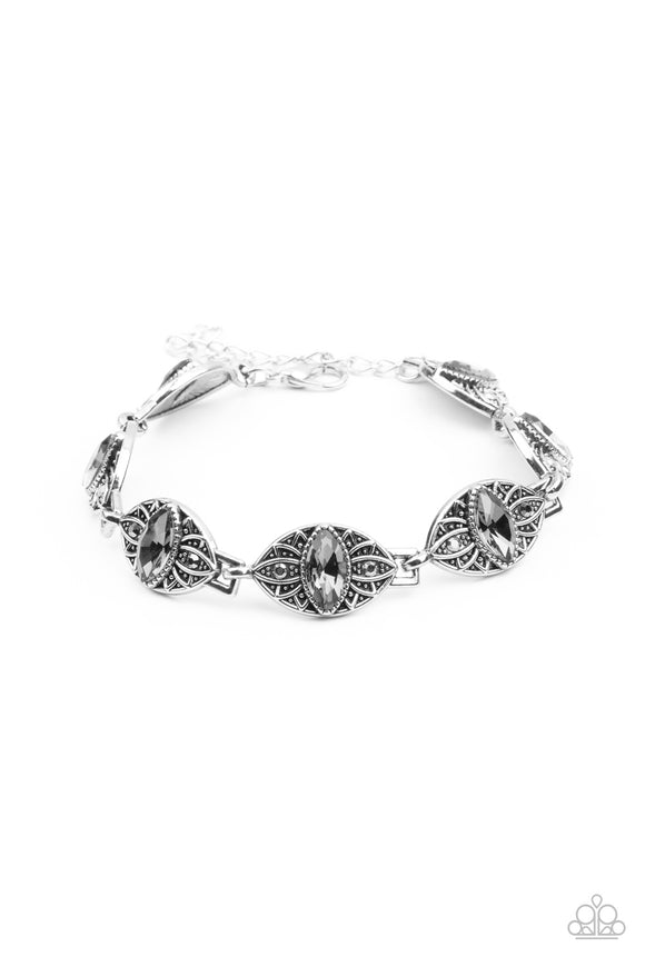 Featuring smoky marquise rhinestone centers, silver studded floral frames are dotted in dainty hematite rhinestones as they link around the wrist for a regal flair. Features an adjustable clasp closure.  Sold as one individual bracelet.