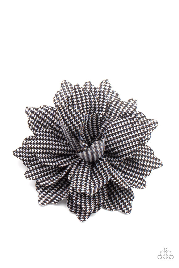 Featuring a black and white plaid-like pattern, scalloped petals delicately gather into a colorful blossom. Features a standard hair clip on the back.  Sold as one individual hair clip.