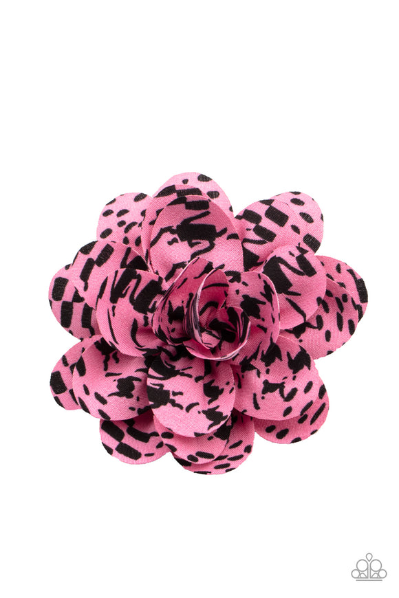 Patterned in black ink-like blots, soft pink petals gather into an abstract blossom for a unique spring inspired look. Features a standard hair clip on the back.  Sold as one individual hair clip.