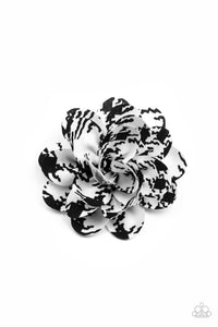 Patterned in black ink-like blots, soft white petals gather into an abstract blossom for a unique spring inspired look. Features a standard hair clip on the back.  Sold as one individual hair clip.